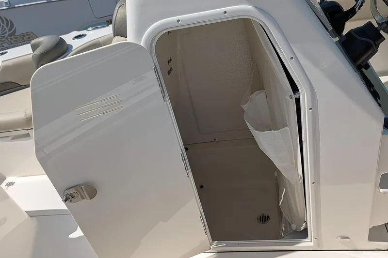 Slide: The Image of Open storage compartment on 2026 Key West 249 FS boat, showcasing interior space. - 19