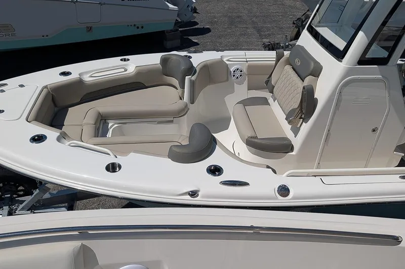 Slide: The Image of 2026 Key West 249 FS boat interior with beige seating and modern design. - 20
