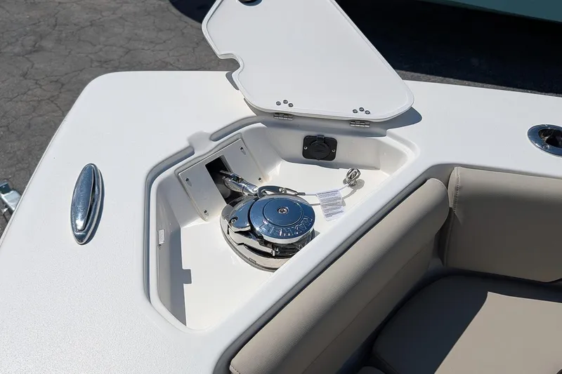 Slide: The Image of Open anchor compartment on 2026 Key West 249 FS boat, showcasing anchor and storage area. - 24
