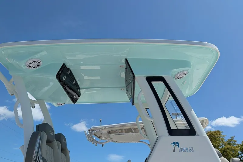 Slide: The Image of 2026 Key West 249 FS boat with sleek design and modern features under clear blue sky. - 25