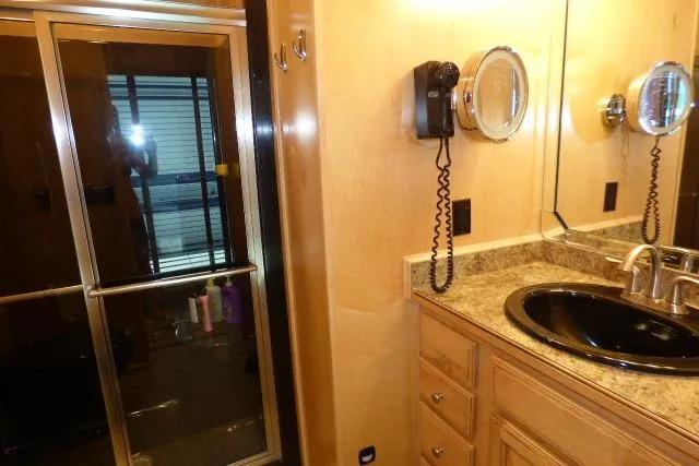 Slide: The Image of Luxurious bathroom in 2009 Sumerset 19x105 houseboat with granite countertop and shower. - 11
