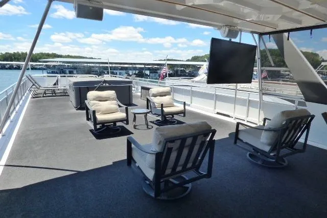 Slide: The Image of Spacious deck of 2009 Sumerset 19x105 houseboat with seating and TV. - 18
