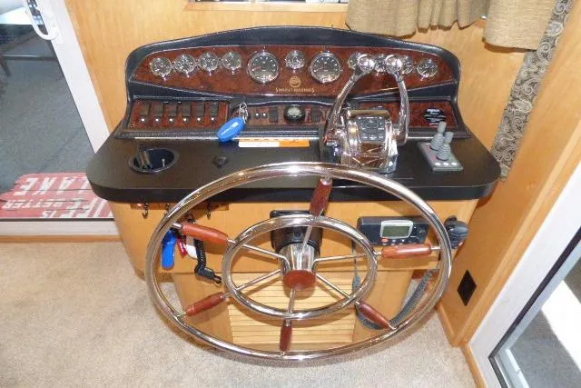 Slide: The Image of 2009 Sumerset 19x105 helm with steering wheel and control panel. - 19