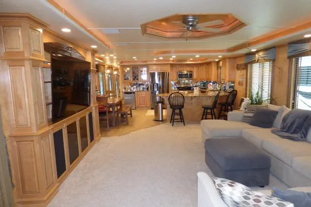 Slide: The Image of Luxurious 2009 Sumerset 19x105 houseboat interior with spacious living area and modern kitchen. - 2