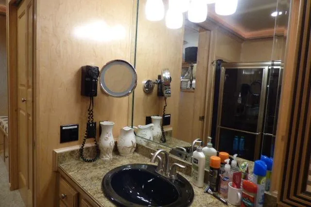 Slide: The Image of Luxurious bathroom in 2009 Sumerset 19x105 houseboat with modern fixtures and amenities. - 8