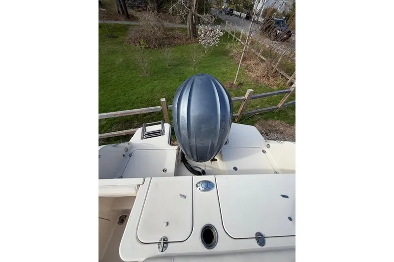Slide: The Image of 2012 Grady-White Freedom 235 boat with outboard motor, viewed from above. - 13