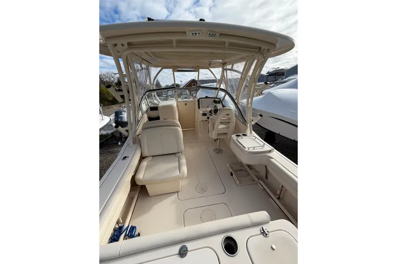 Slide: The Image of 2012 Grady-White Freedom 235 boat interior with seating and helm station. - 4