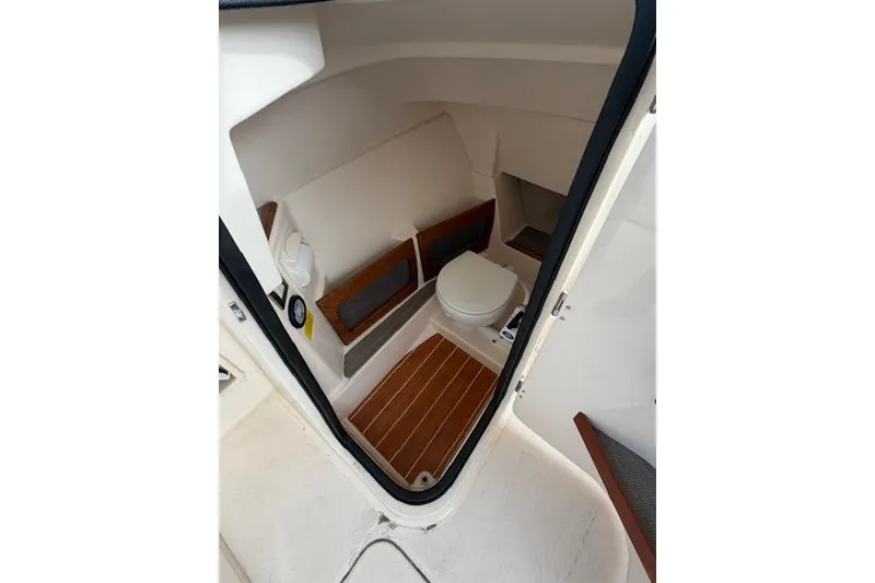 Slide: The Image of Interior view of 2012 Grady-White Freedom 235 boat's compact bathroom. - 5