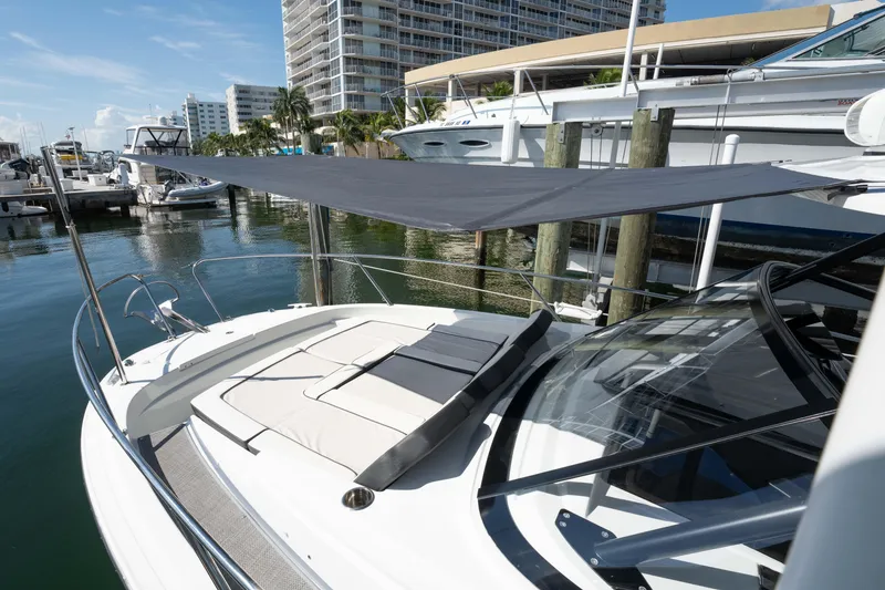 Slide: The Image of 2024 Jeanneau Leader 9.0 WA Series 2 yacht docked at marina with sunshade. - 14