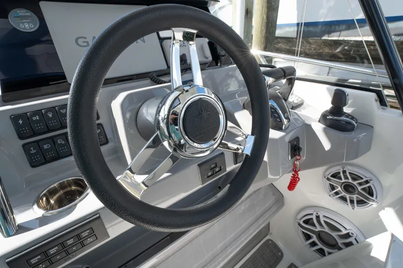 Slide: The Image of Steering wheel and controls of 2024 Jeanneau Leader 9.0 WA Series 2 boat. - 16