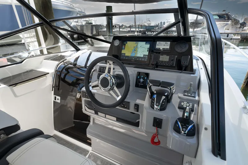 Slide: The Image of 2024 Jeanneau Leader 9.0 WA Series 2 cockpit with advanced navigation controls and steering wheel. - 17
