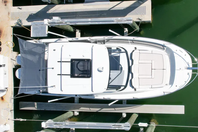 Slide: The Image of Overhead view of 2024 Jeanneau Leader 9.0 WA Series 2 docked at marina. - 2