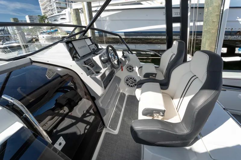 Slide: The Image of 2024 Jeanneau Leader 9.0 WA Series 2 cockpit with dual seats and Garmin navigation. - 21