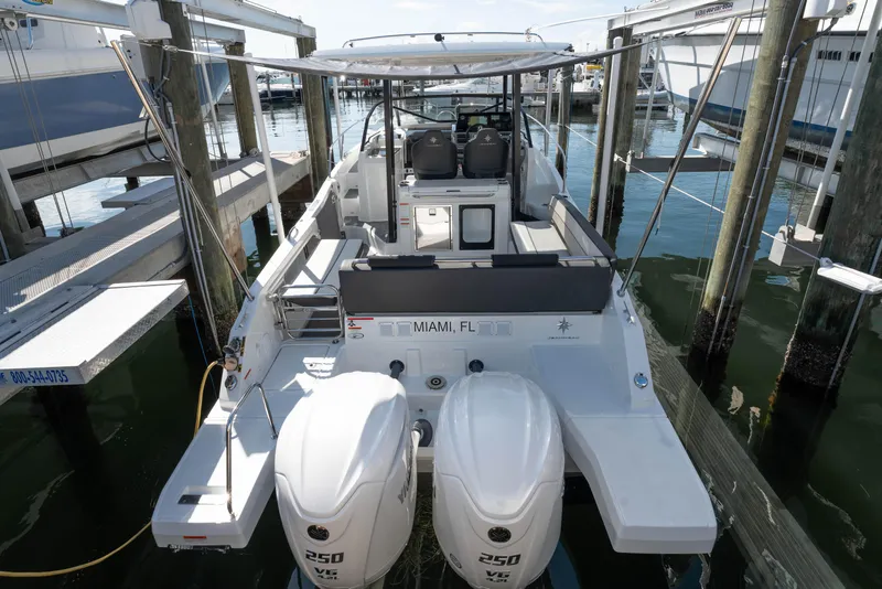 Slide: The Image of 2024 Jeanneau Leader 9.0 WA Series 2 boat docked with dual 250 HP engines. - 3