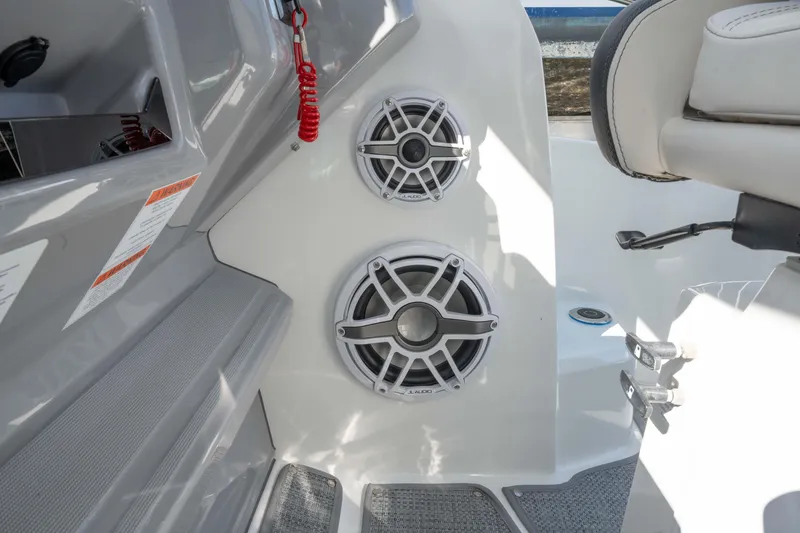 Slide: The Image of 2024 Jeanneau Leader 9.0 WA Series 2 boat interior with dual JL Audio speakers. - 36