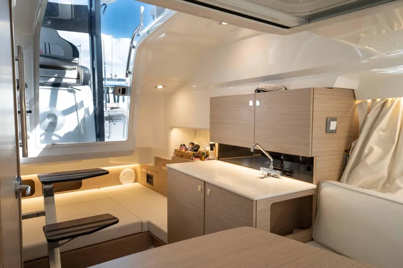 Slide: The Image of 2024 Jeanneau Leader 9.0 WA Series 2 interior with modern kitchen and seating area. - 41