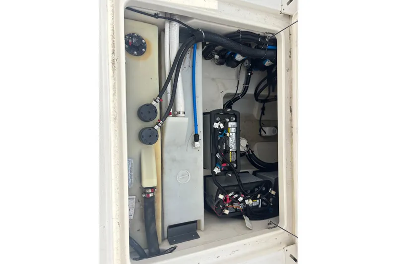 Slide: The Image of 2019 Boston Whaler 270 Vantage engine compartment with wiring and components. - 17