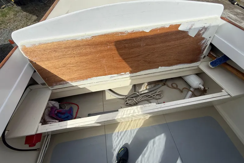 Slide: The Image of 2024 Hylan Bowler boat interior with storage compartments and ropes. - 23