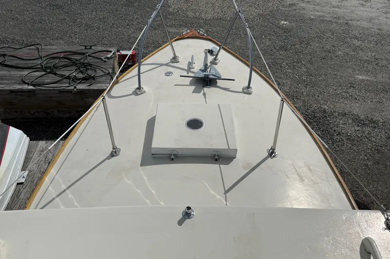 Slide: The Image of Bow of 2024 Hylan Bowler boat with anchor and deck railing. - 31