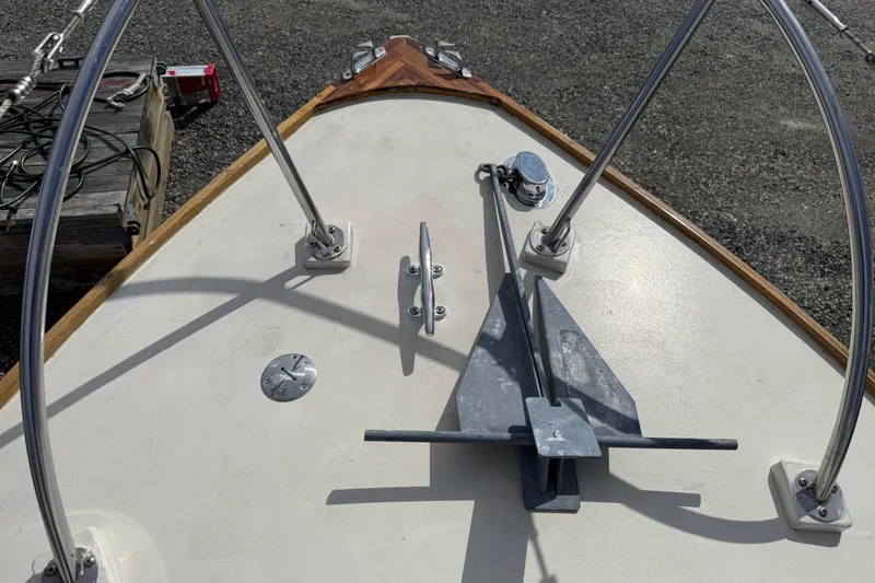 Slide: The Image of Bow of 2024 Hylan Bowler boat with anchor and metal railings. - 33