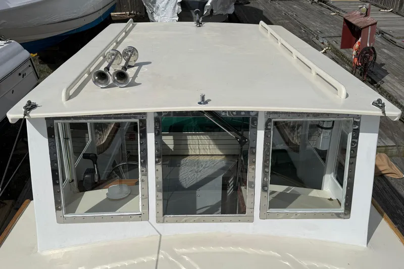 Slide: The Image of 2024 Hylan Bowler boat cabin with windows and roof-mounted horns. - 34