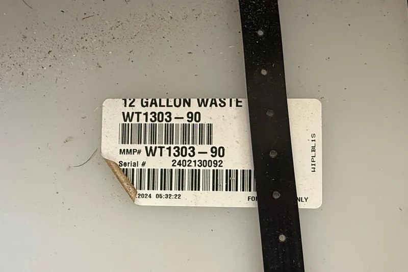 Slide: The Image of Label on a 12-gallon waste container, model WT1303-90, serial 2402130092, Hylan Bowler 2024. - 40