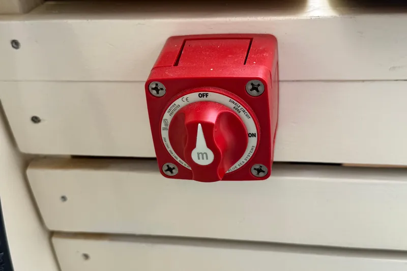 Slide: The Image of Red electrical switch on a Hylan Bowler 2024 boat panel. - 43