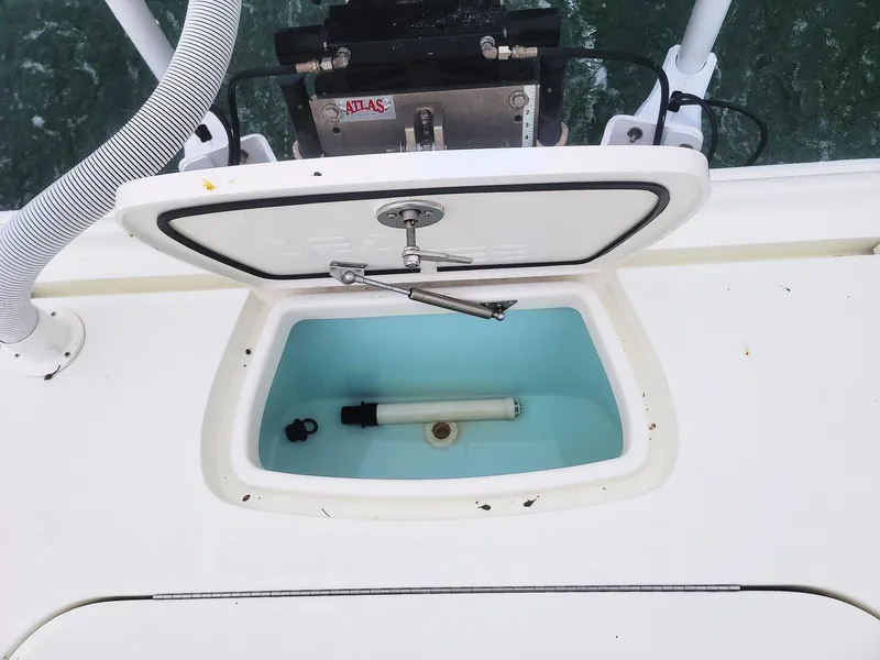 Slide: The Image of 2017 SeaVee 270Z livewell with open lid, showcasing interior and water pump. - 21