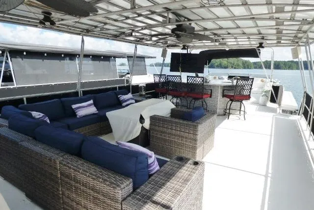 Slide: The Image of Spacious 1997 Sumerset 16x80 houseboat deck with seating, bar, and lake view. - 12