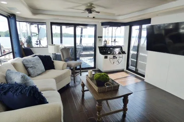 Slide: The Image of Luxurious 1997 Sumerset 16x80 houseboat interior with modern decor and lake view. - 3