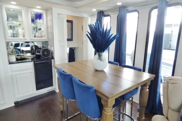 Slide: The Image of Luxurious 1997 Sumerset 16x80 houseboat interior with elegant dining area and modern decor. - 5