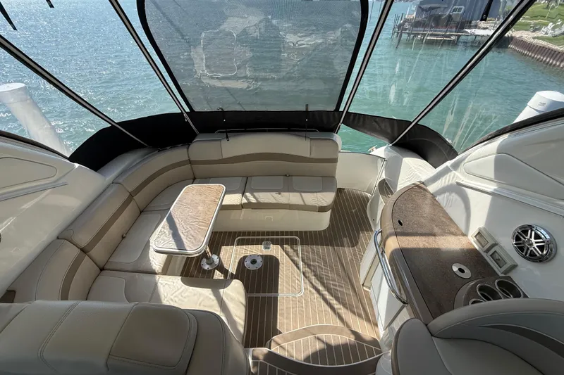 Slide: The Image of Luxurious interior of a 2014 Formula 37 Performance Cruiser with elegant seating and table. - 12