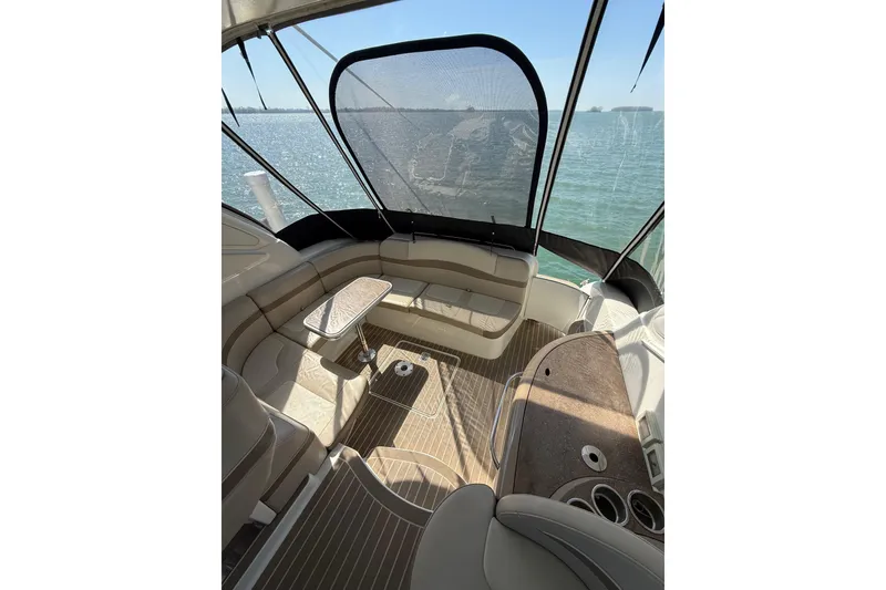 Slide: The Image of 2014 Formula 37 Performance Cruiser interior with seating and table, overlooking the water. - 13