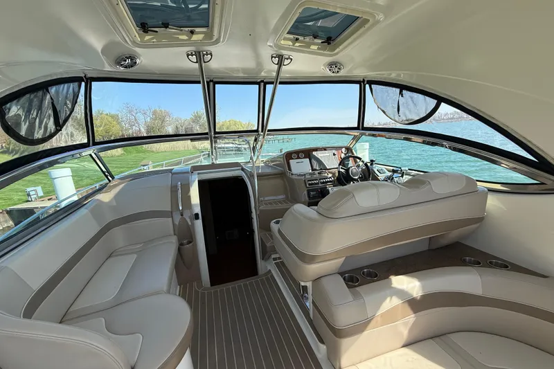 Slide: The Image of Interior of a 2014 Formula 37 Performance Cruiser with beige seating and panoramic windows. - 14
