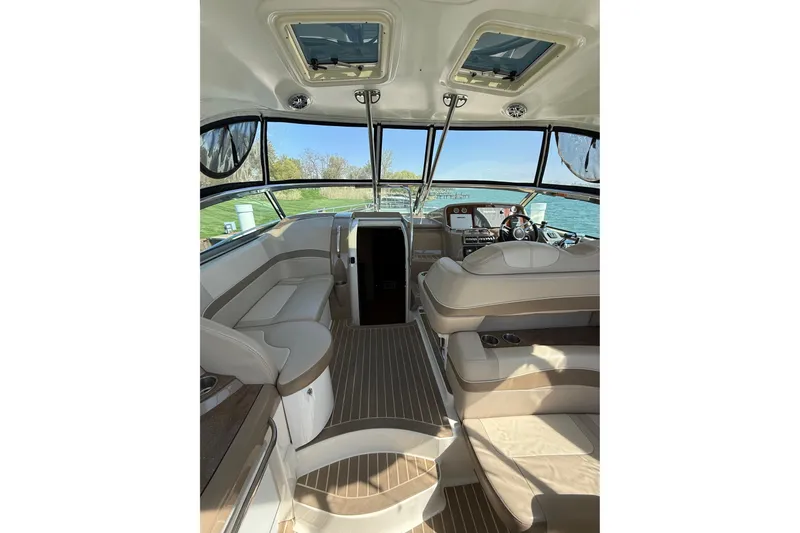 Slide: The Image of Interior of 2014 Formula 37 Performance Cruiser with luxurious seating and helm, overlooking water. - 15