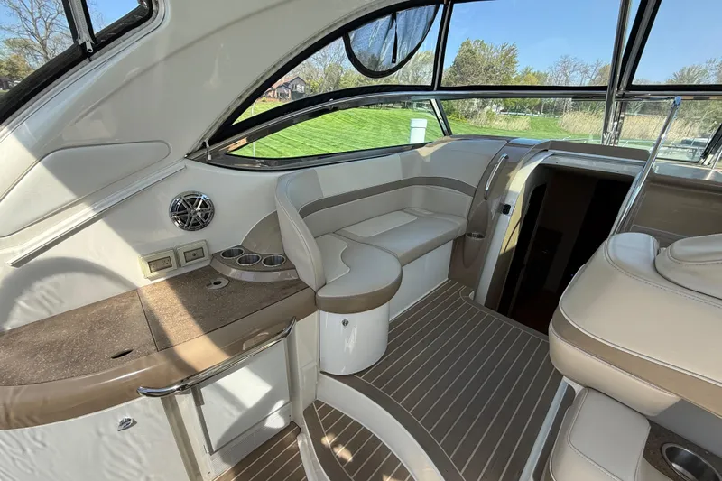 Slide: The Image of 2014 Formula 37 Performance Cruiser interior with beige seating and wood accents. - 18