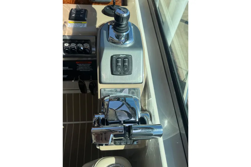 Slide: The Image of Control panel of a 2014 Formula 37 Performance Cruiser boat, featuring throttle and joystick controls. - 22