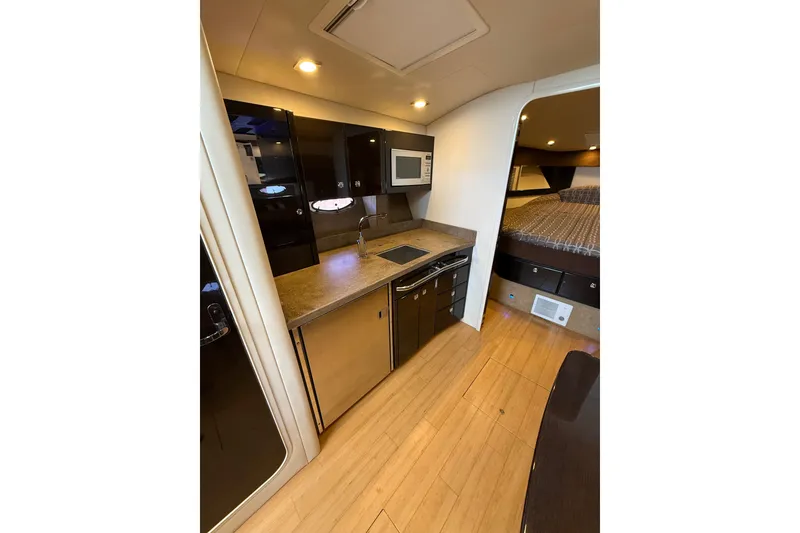 Slide: The Image of Interior of 2014 Formula 37 Performance Cruiser with kitchenette and sleeping area. - 25