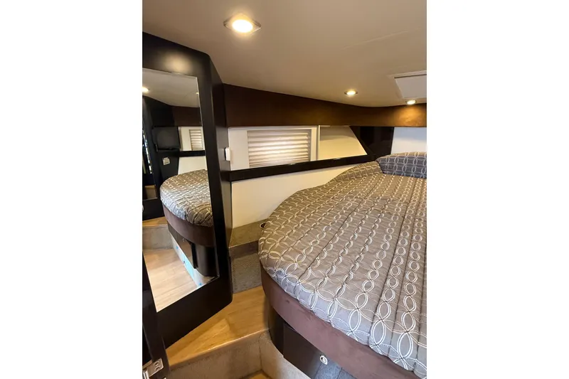 Slide: The Image of 2014 Formula 37 Performance Cruiser cabin with bed, mirror, and modern lighting. - 33