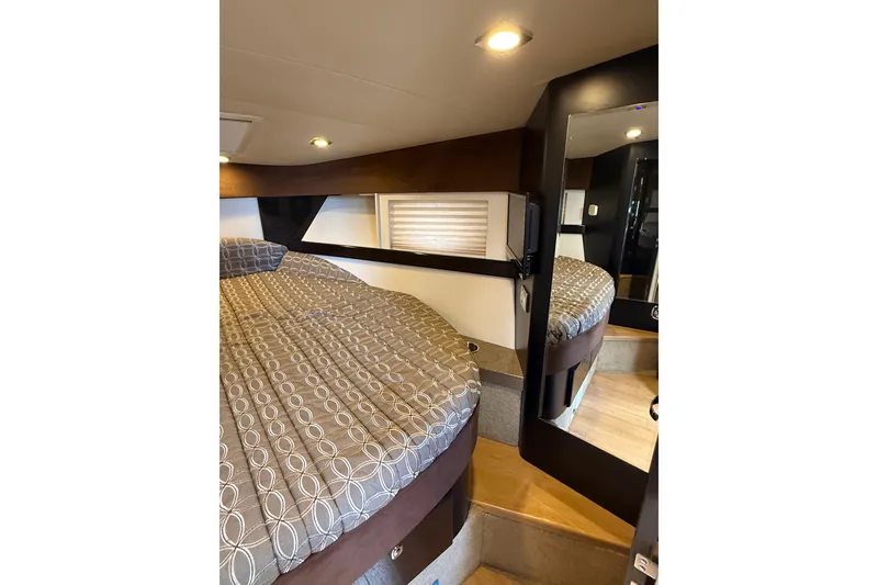 Slide: The Image of 2014 Formula 37 Performance Cruiser cabin with patterned bedding and modern interior design. - 34