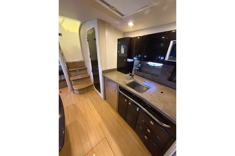 Slide: The Image of Interior of 2014 Formula 37 Performance Cruiser with modern kitchen and wooden flooring. - 39