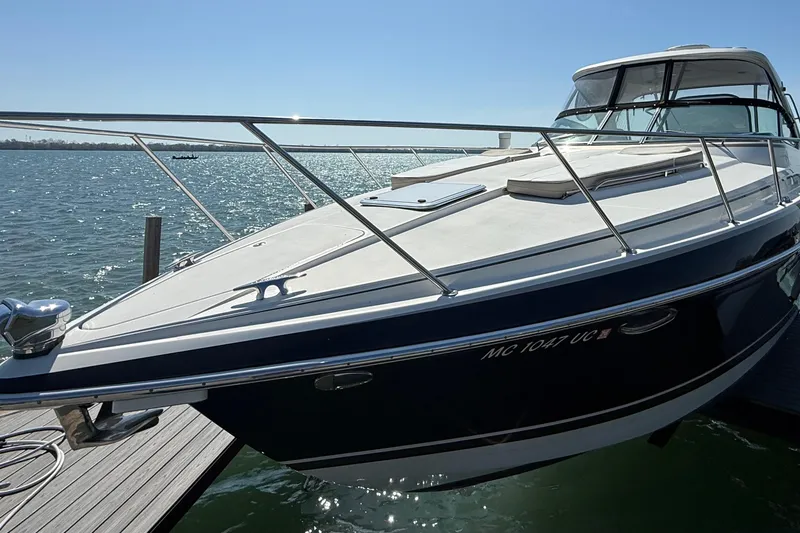 Slide: The Image of 2014 Formula 37 Performance Cruiser docked on sunny waterfront. - 4