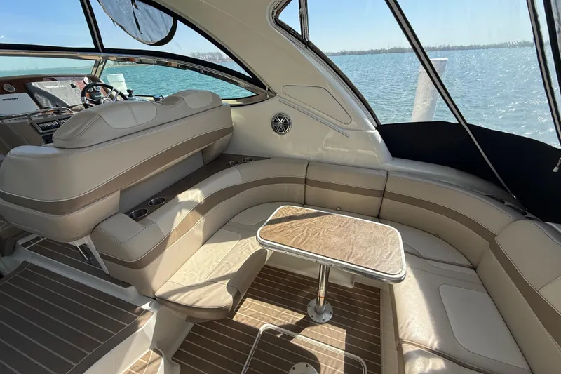 Slide: The Image of Luxurious interior of a 2014 Formula 37 Performance Cruiser with elegant seating and table. - 9