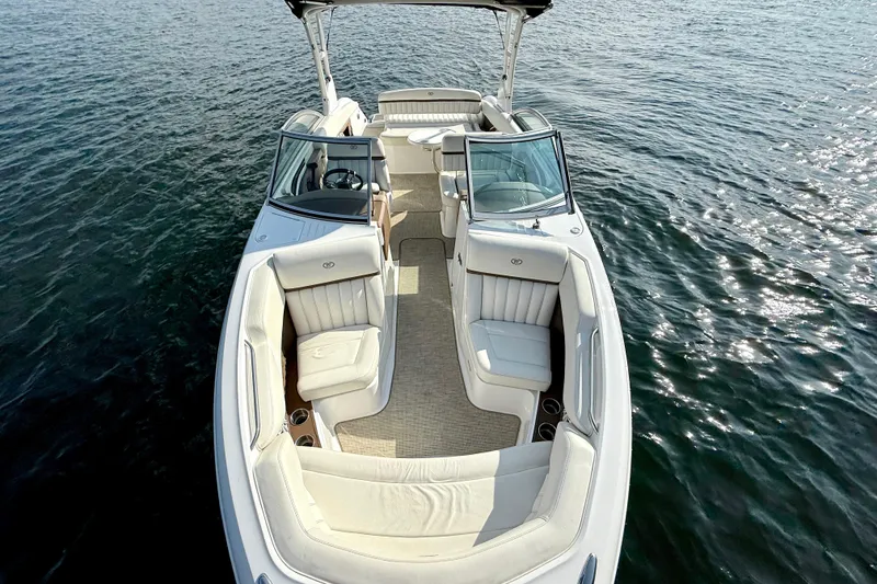 Slide: The Image of 2013 Cobalt A25 boat with white interior on calm water. - 21