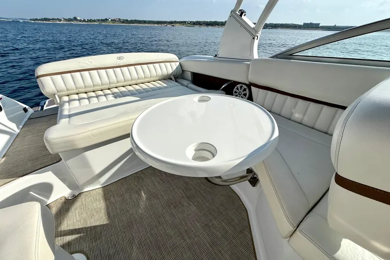 Slide: The Image of Luxurious seating area on a 2013 Cobalt A25 boat with ocean view. - 23