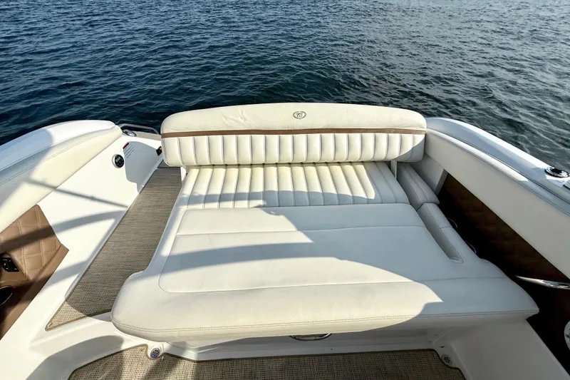 Slide: The Image of Luxurious seating on a 2013 Cobalt A25 boat with water view. - 24