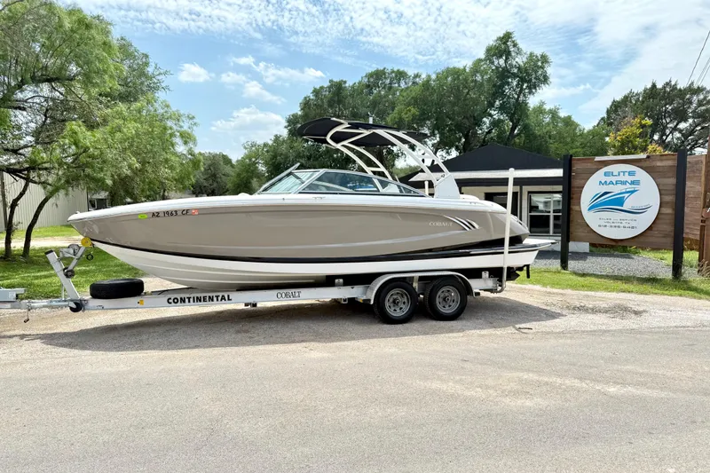 Slide: The Image of 2013 Cobalt A25 boat on trailer at Elite Marine dealership. - 3