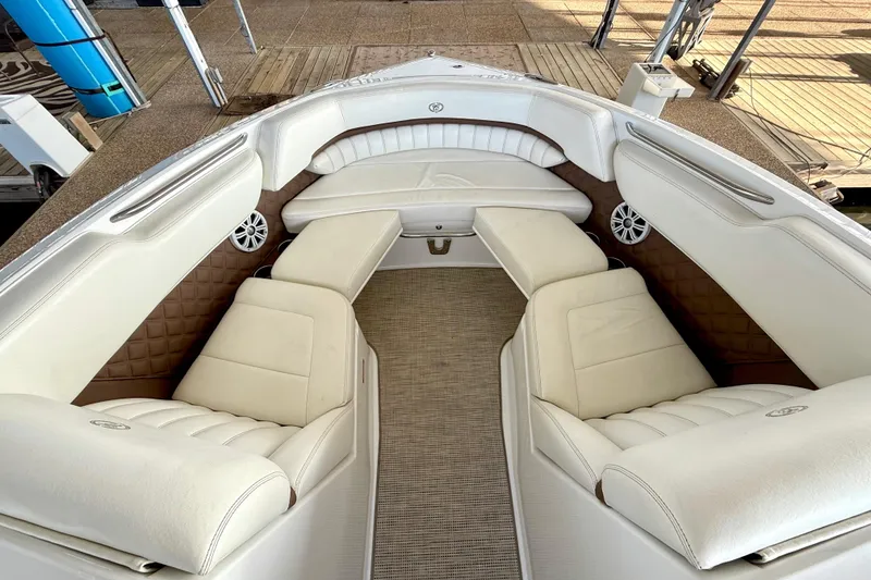 Slide: The Image of Luxurious interior of a 2013 Cobalt A25 boat with white leather seating. - 33
