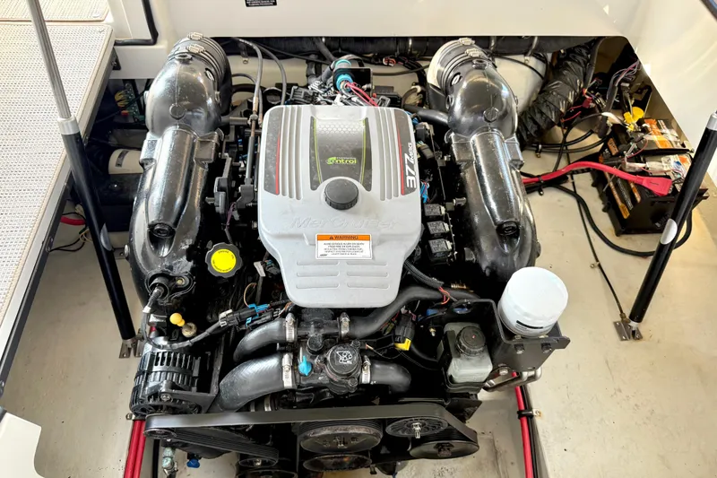 Slide: The Image of Engine compartment of a 2013 Cobalt A25 boat featuring a MerCruiser engine. - 41