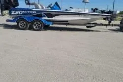 The Image of 2019 Nitro Z20 Pro boat on trailer, parked outdoors. - 1